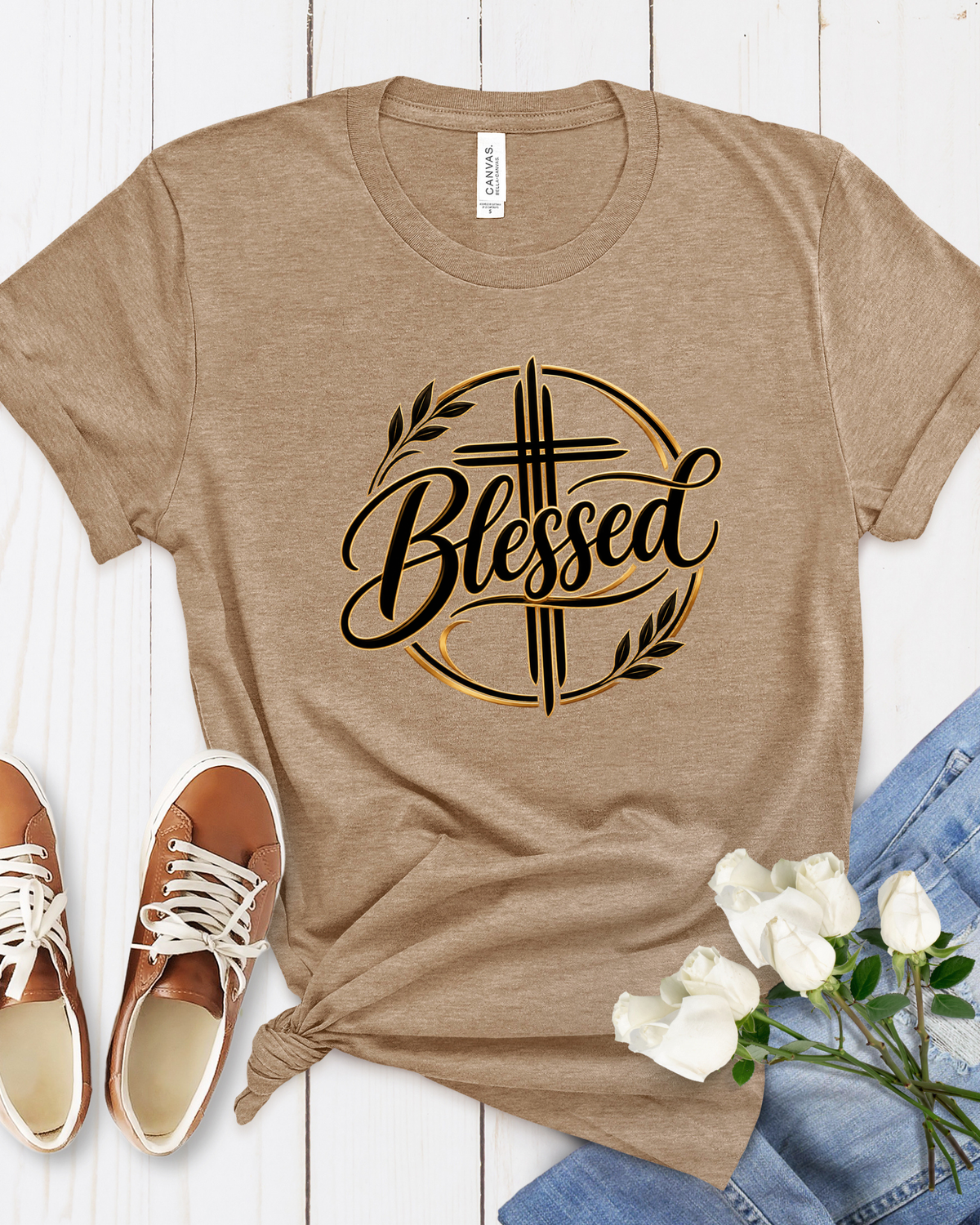 Flatlay of a Blessed cross Christian heather tan graphic tee